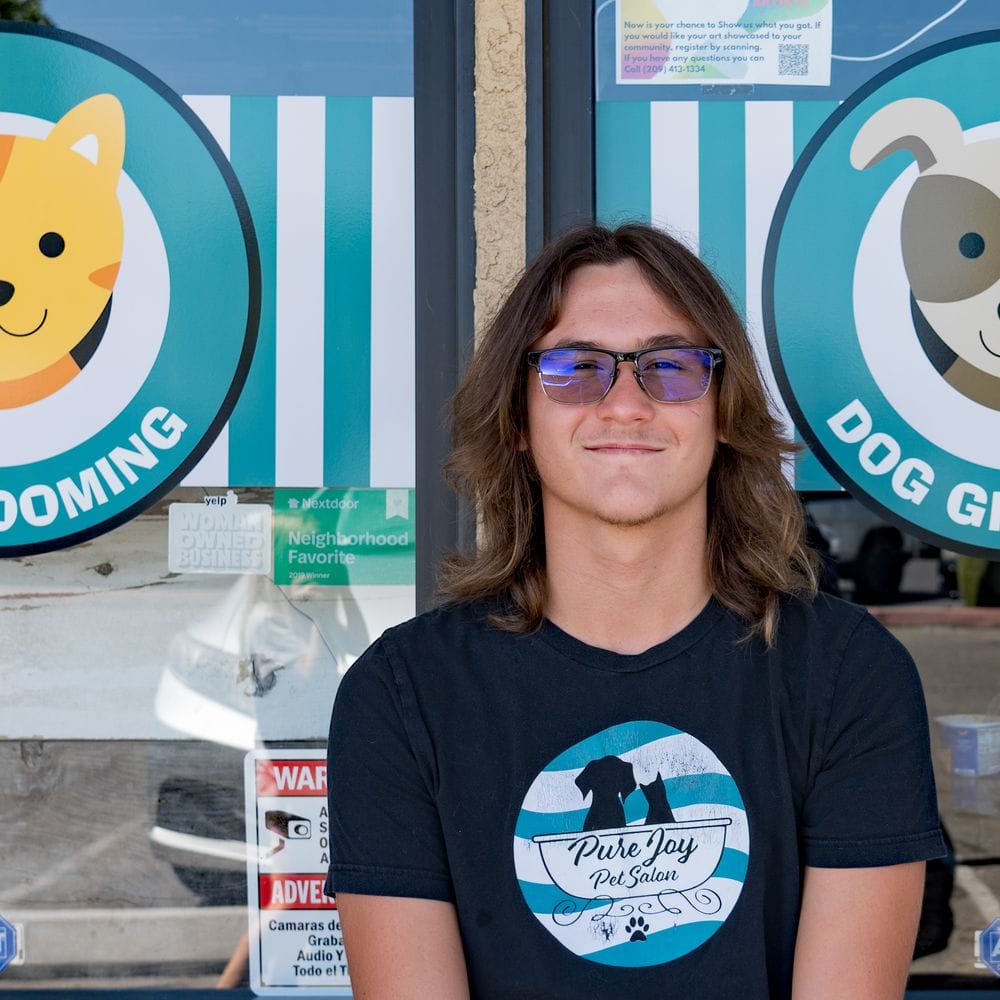 Zak, bather at Pure Joy Pet Salon, outside the Atwater salon